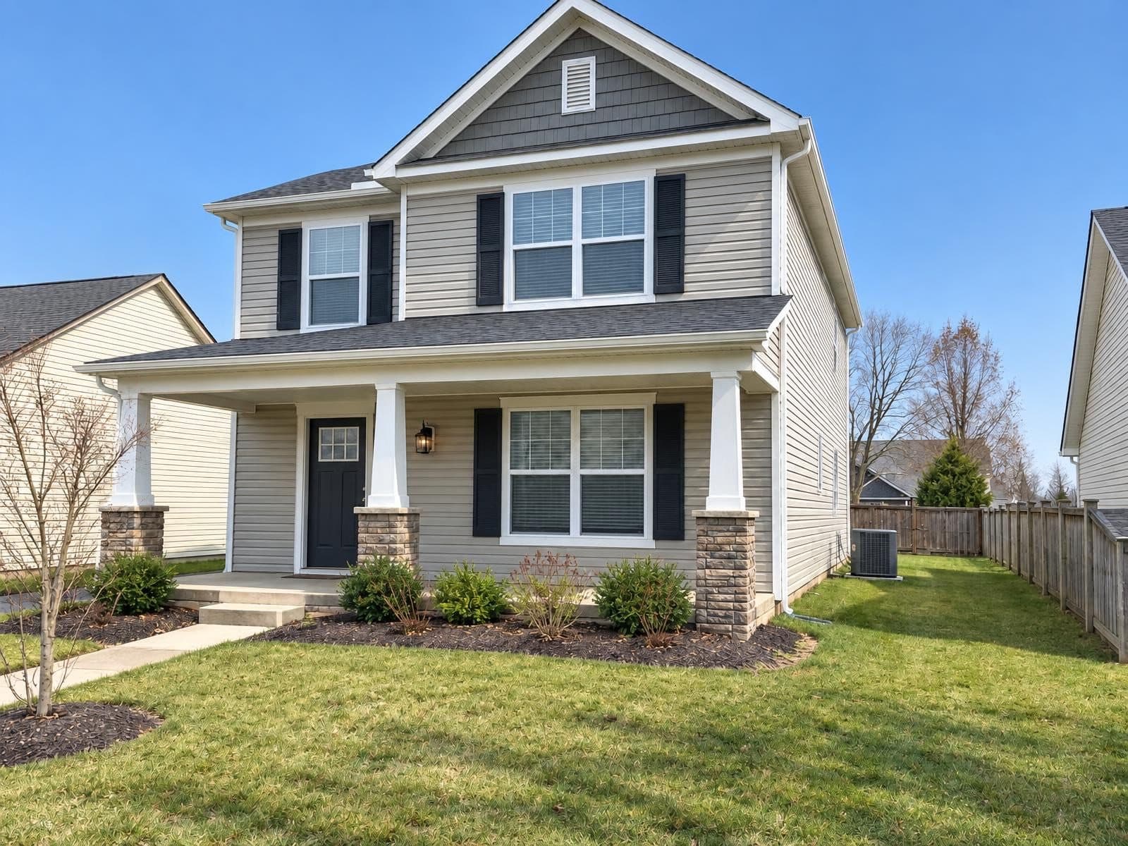Two-story house exterior with the sky replaced by Sky Fix